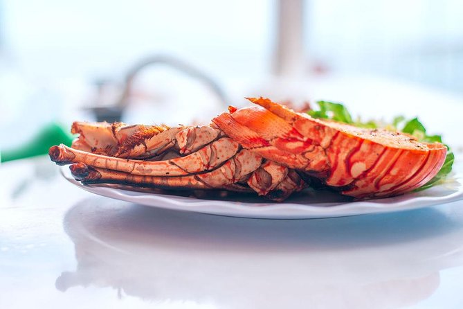 Antigua Seafood Lunch Cruise From St. John's - Caribbean music turns lunch into a social event