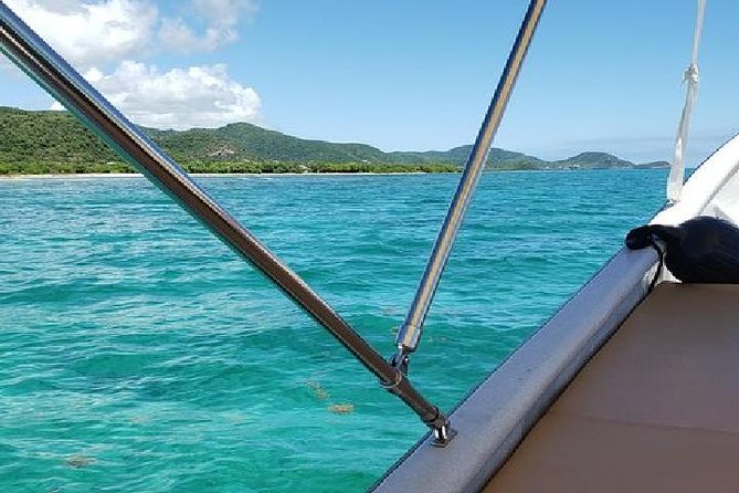 Snorkel and Exclusive Beach Exploration in Antigua - Local snacks and a rum punch on board